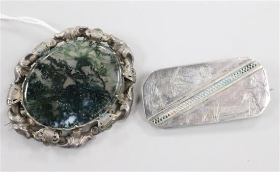 A Victorian silver-framed moss agate brooch and an engraved silver brooch